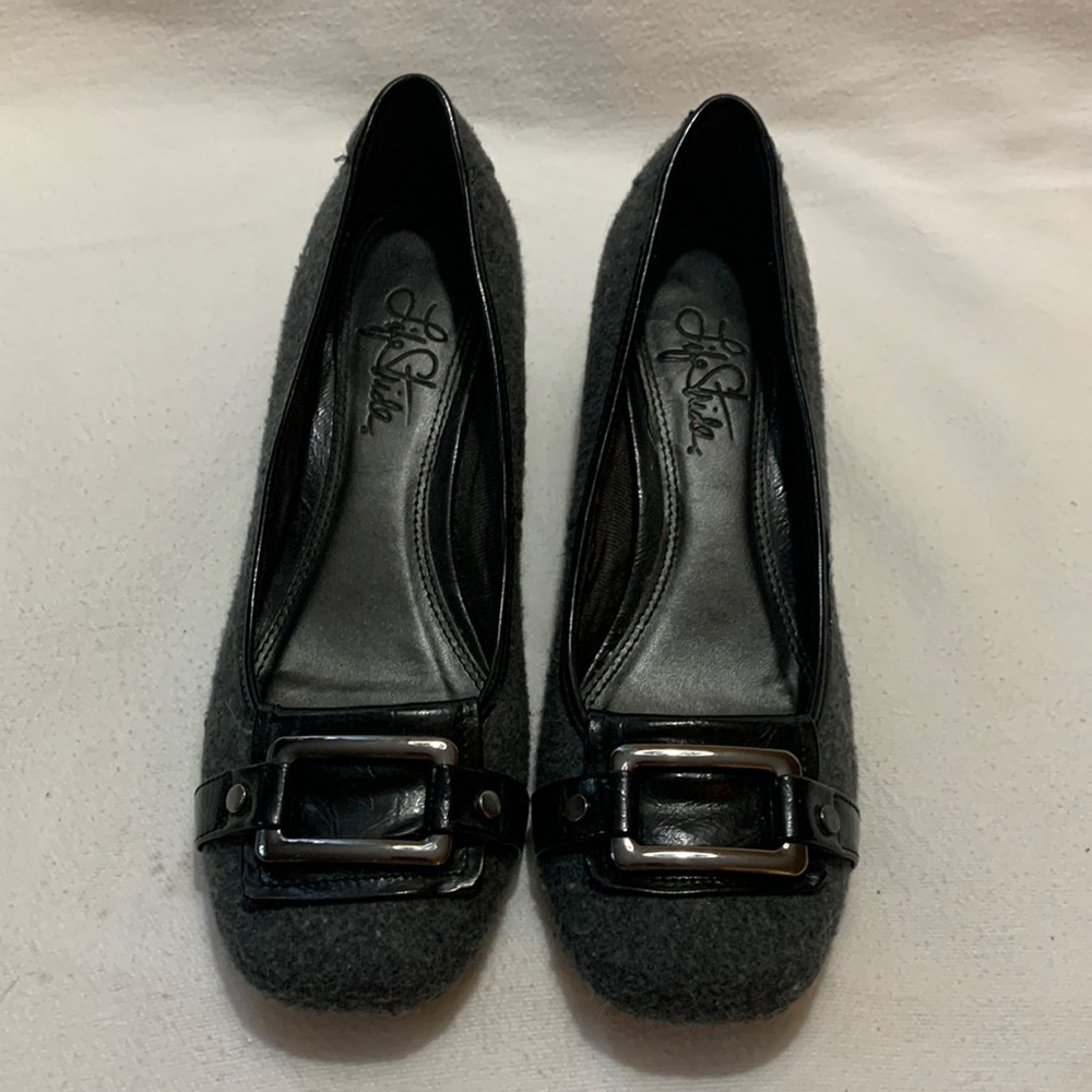 Grey felt texture, 1.5 in black leather heel, strap & silver buckle detail.